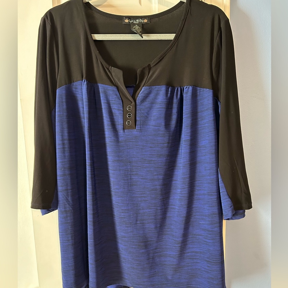 Suzie in the City 1X blue and black top.